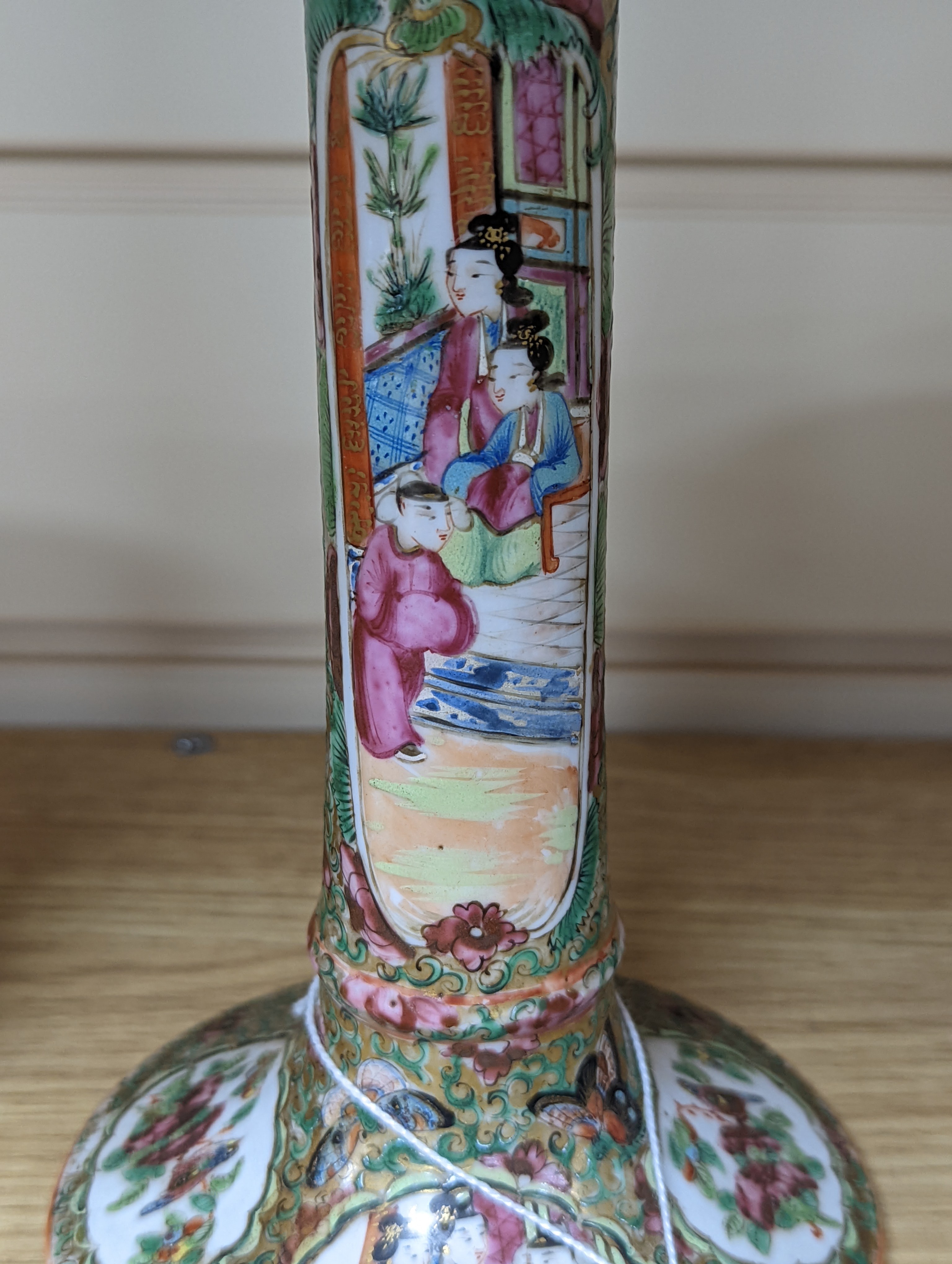 A Chinese Canton famille rose nest of boxes and covers, a similar candlestick and a tray 23cm